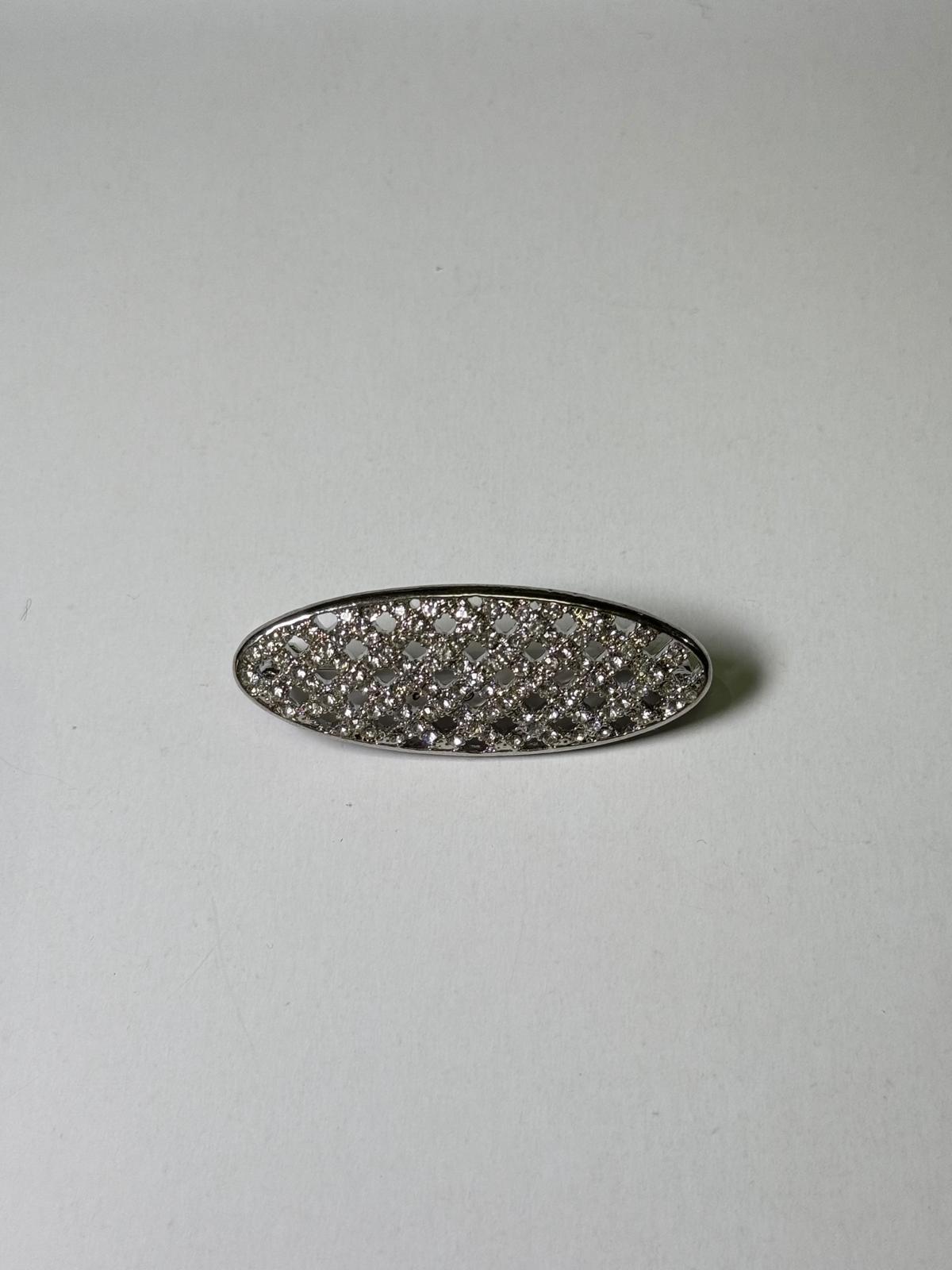 Broche rodio plateado. Modelo 5