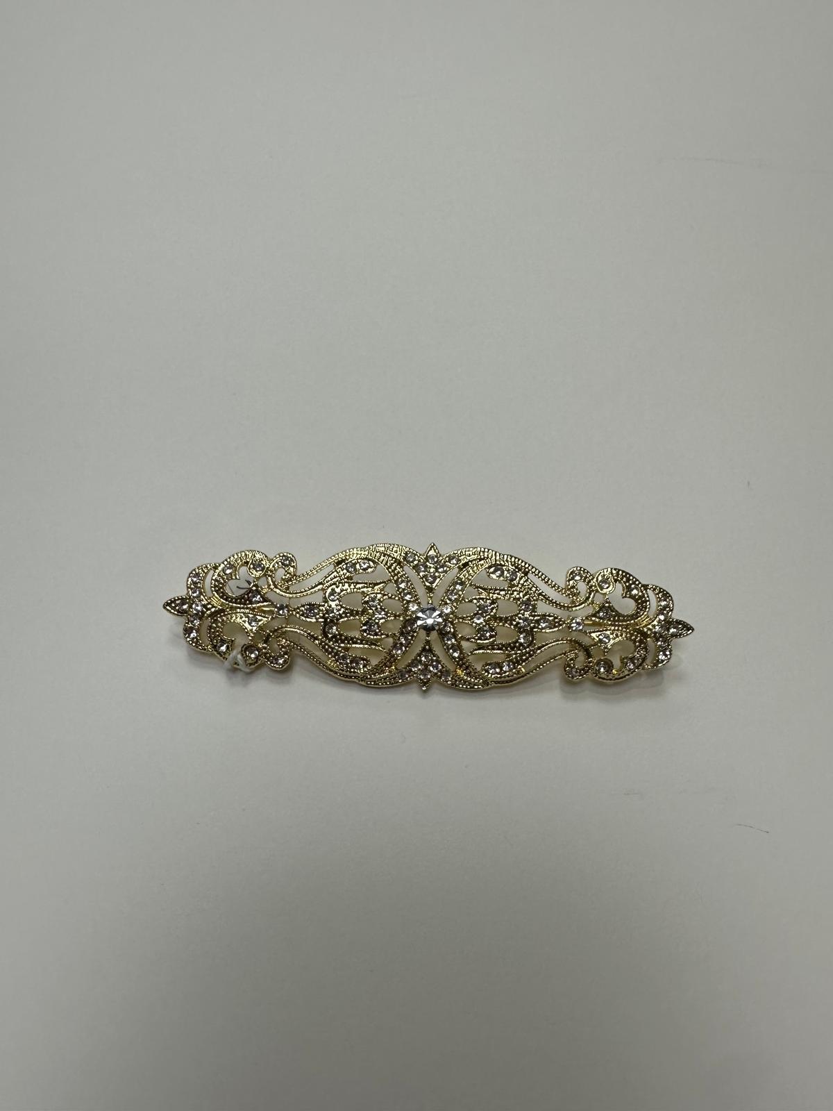 Broche rodio dorado. Modelo 15