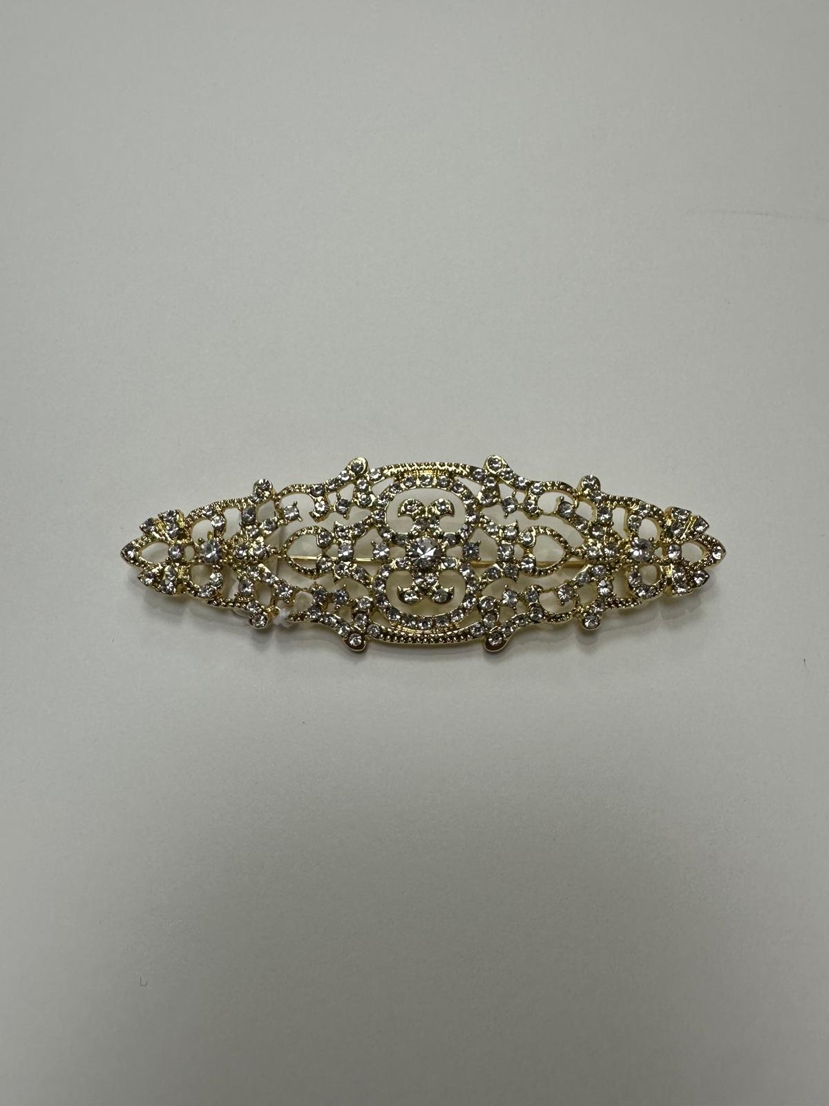Broche rodio dorado. Modelo 16