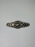 Broche rodio plateado. Modelo 6