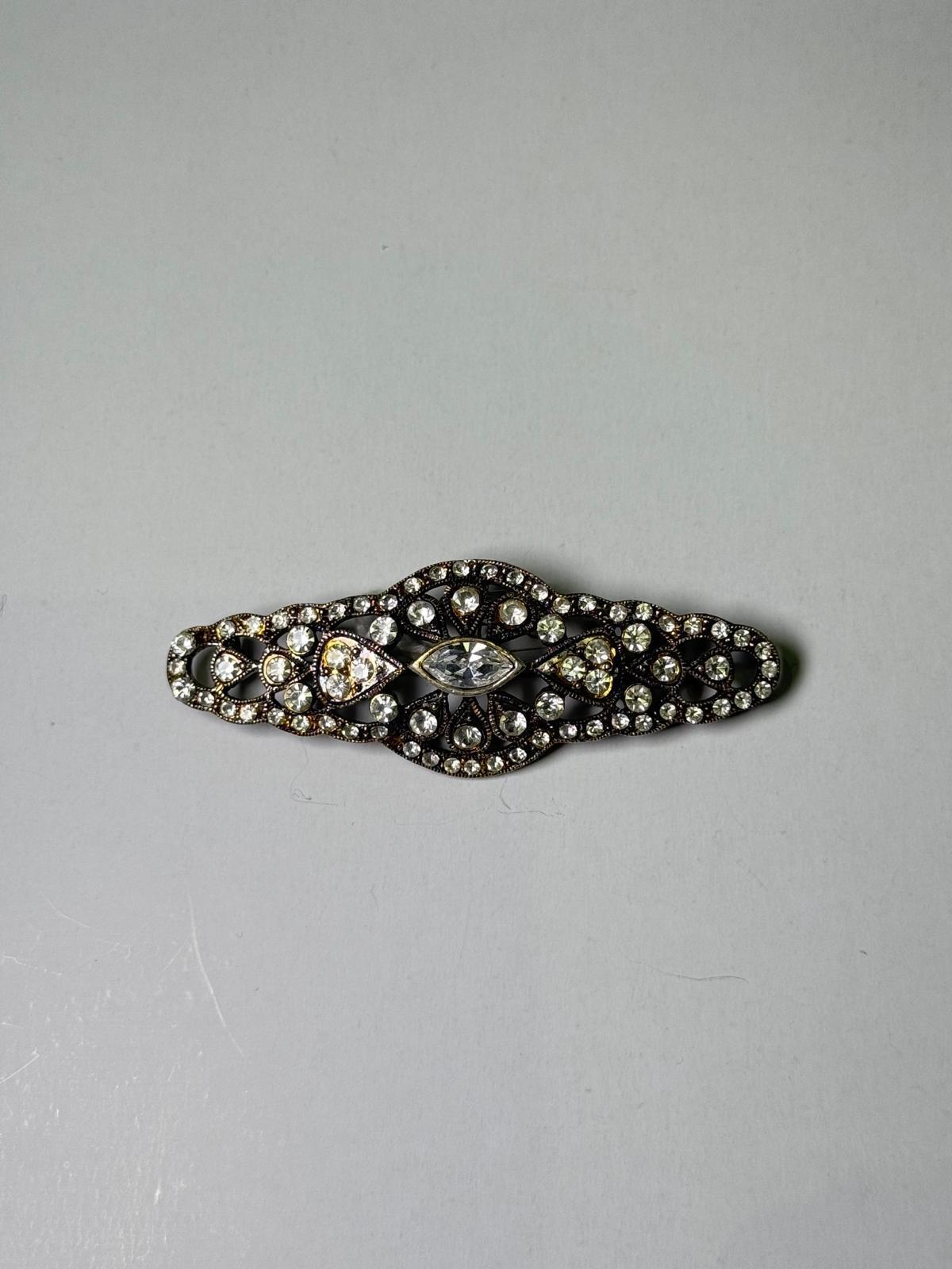 Broche rodio plateado. Modelo 6