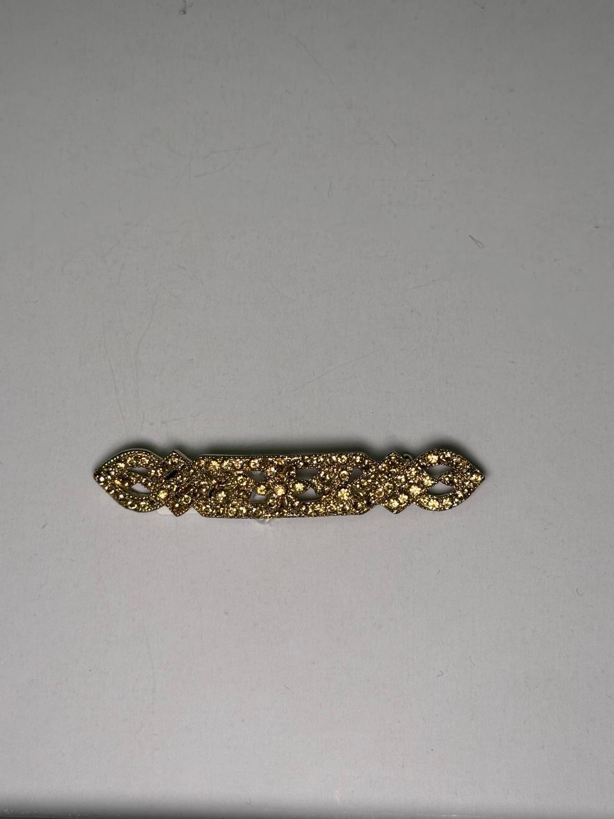Broche rodio dorado. Modelo 18