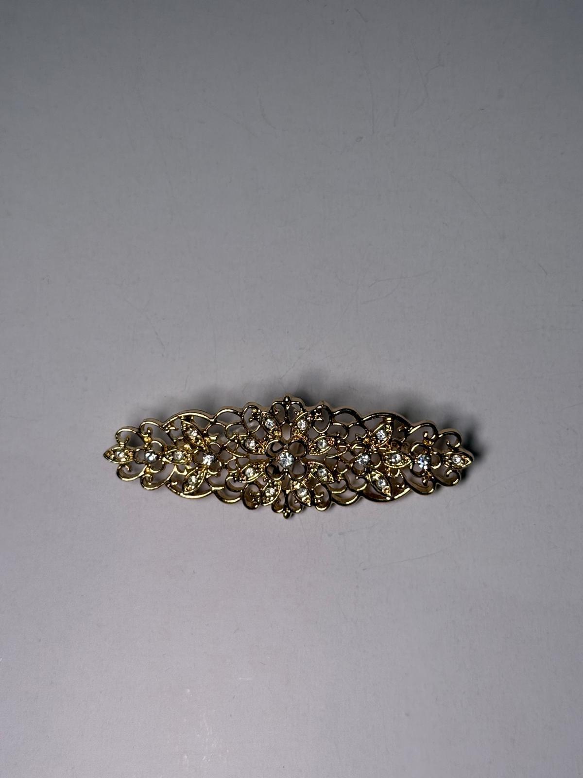 Broche rodio dorado. Modelo 19