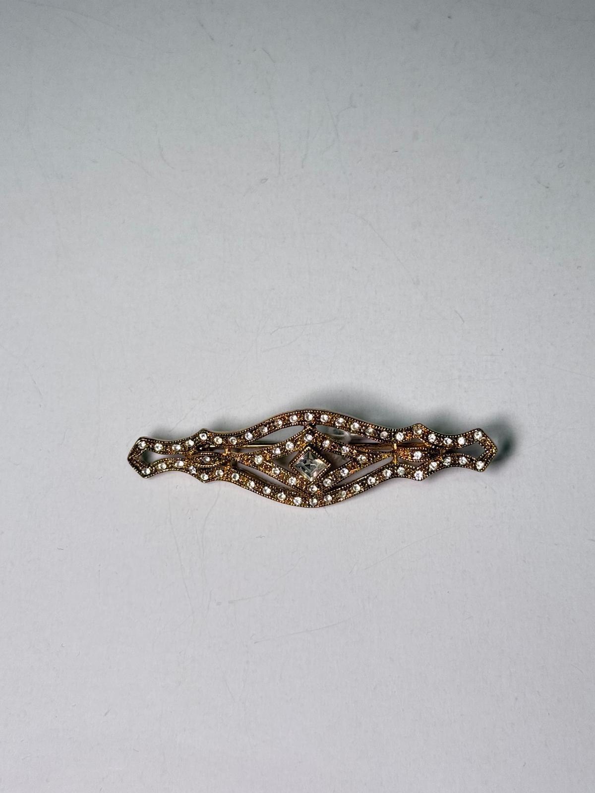 Broche rodio dorado. Modelo 20