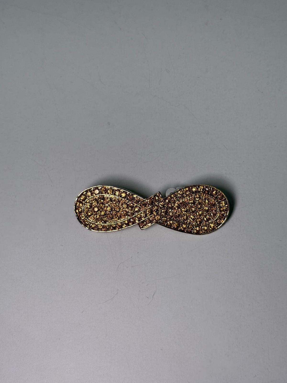 Broche rodio dorado. Modelo 23