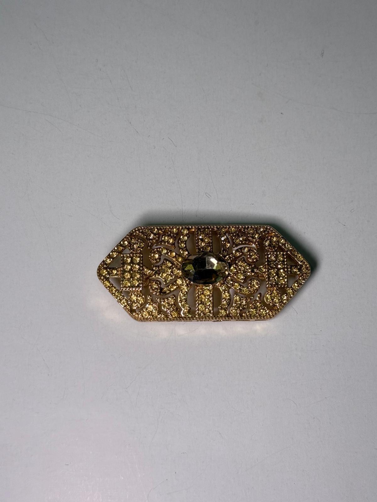 Broche rodio dorado.Modelo 24